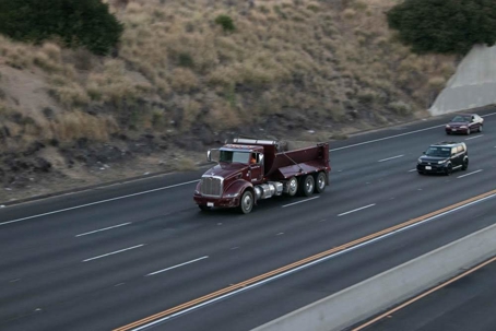 Truck Strikes Car, Woman Hurt on 1500 W